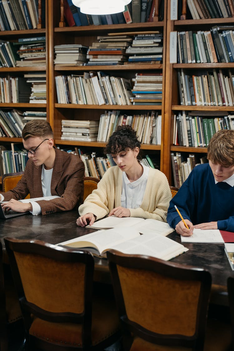 Students Studying Together In A Library