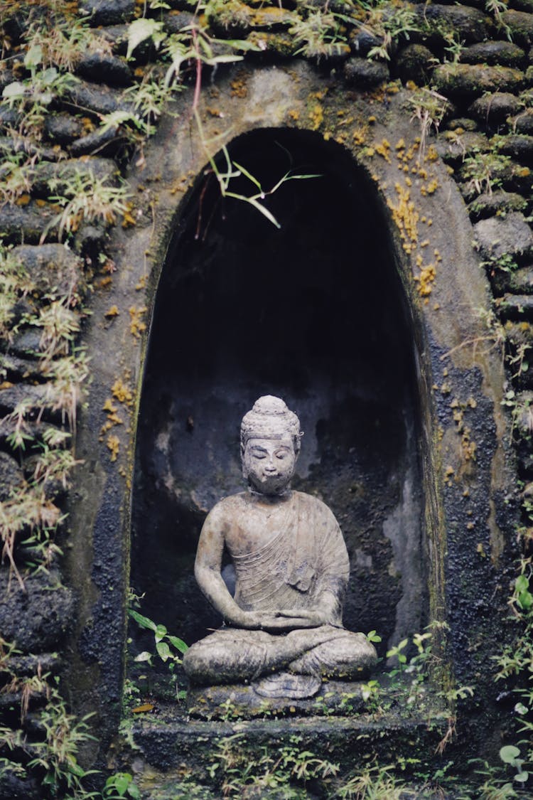 A Buddha Sculpture In A Grotto