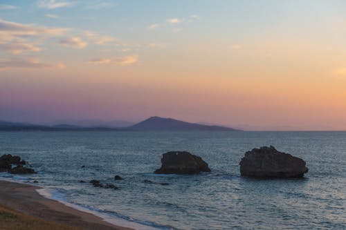 A Rocky Shore during Sunrise