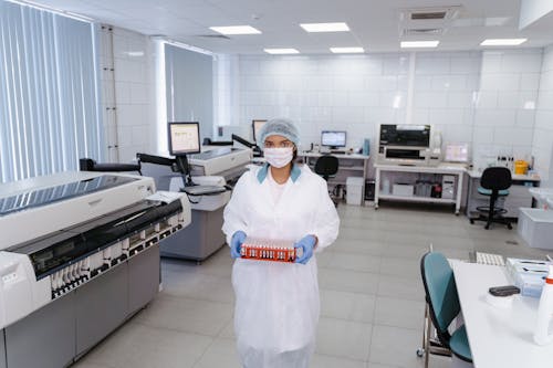 Medical Practitioner holding a Rack of Test Samples 