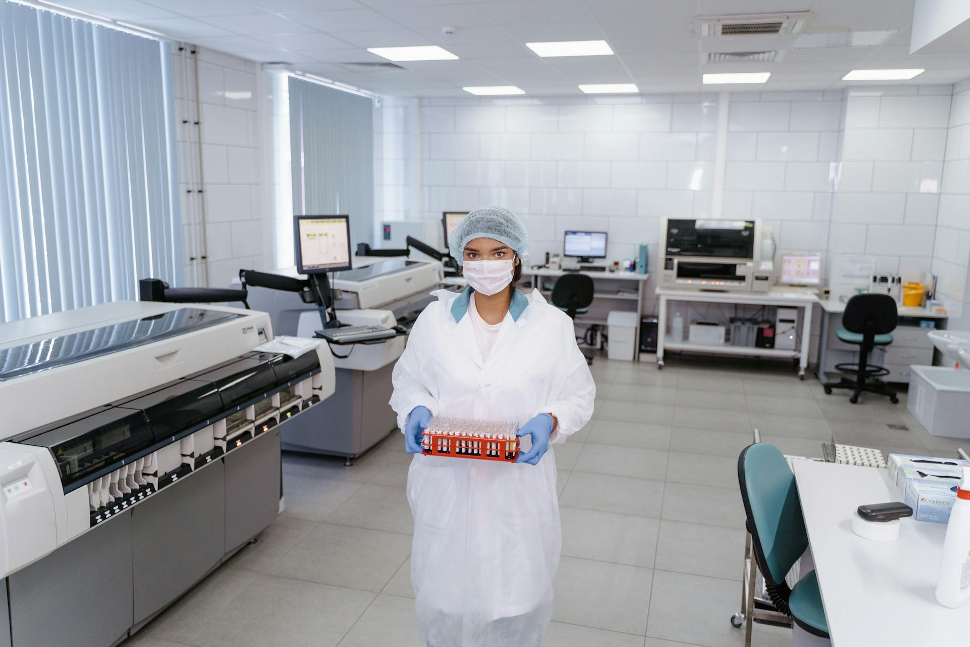 Medical Practitioner holding a Rack of Test Samples