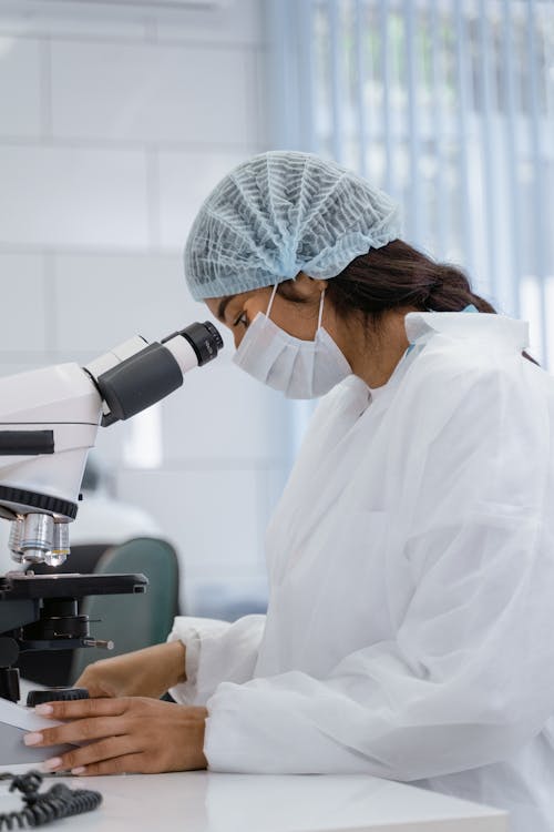 Medical Technologist using a Microscope 