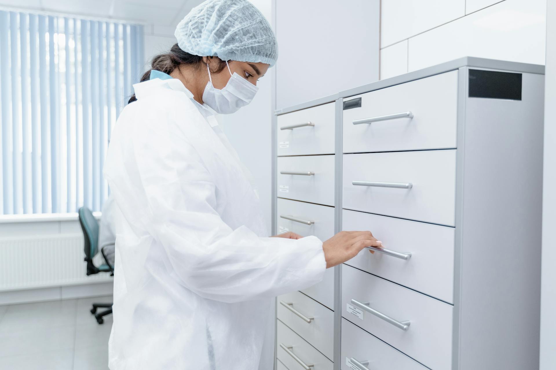 Medical Professional opening a Drawer