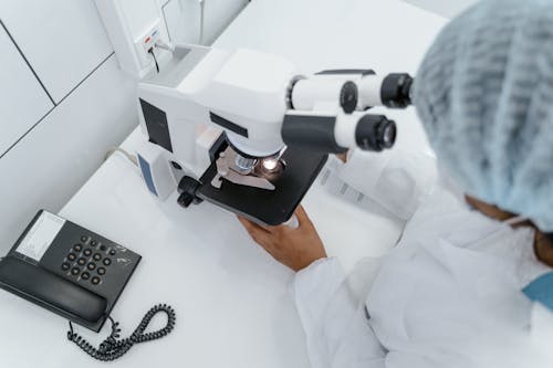 A Person Using a Microscope