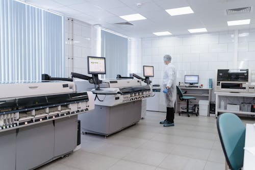 A Person Standing Inside the Laboratory while Looking at the Screen