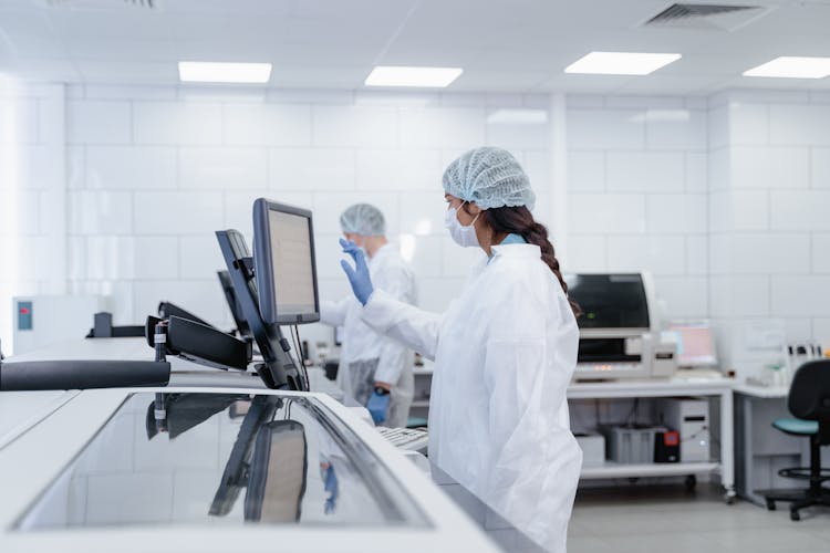 A Woman In White Lab Gown