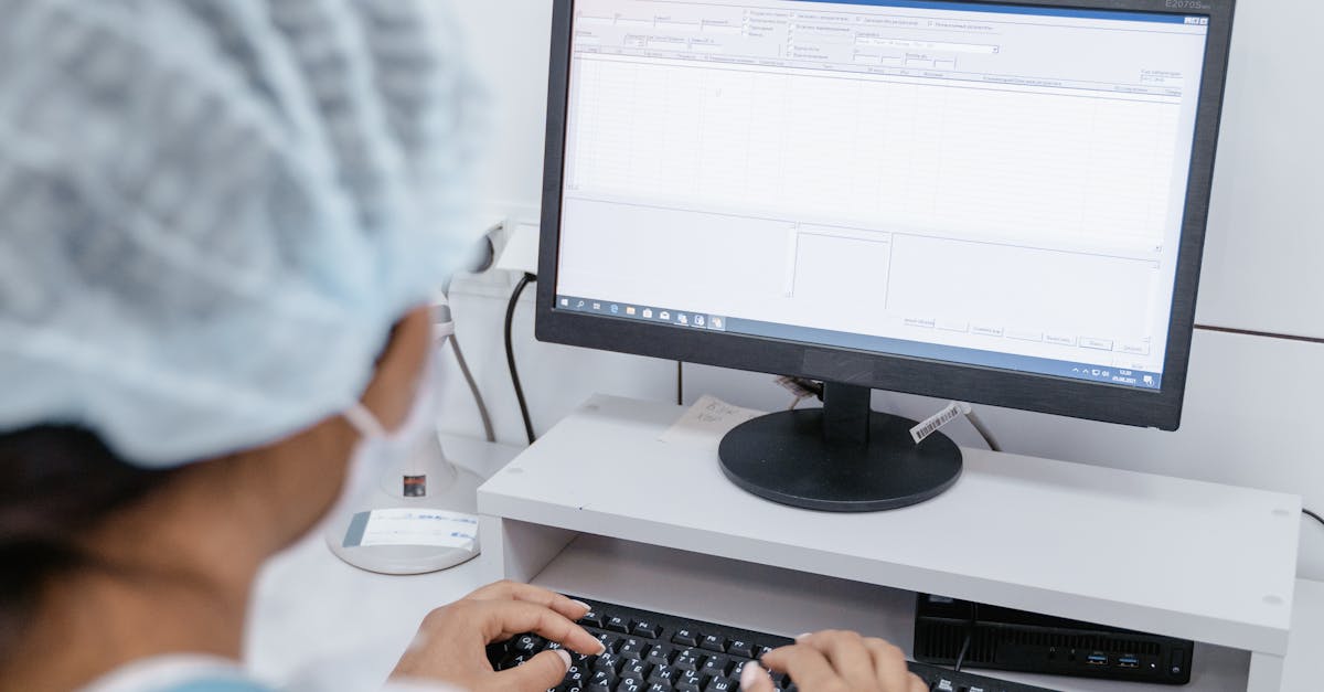 Medical Professional using Computer · Free Stock Photo