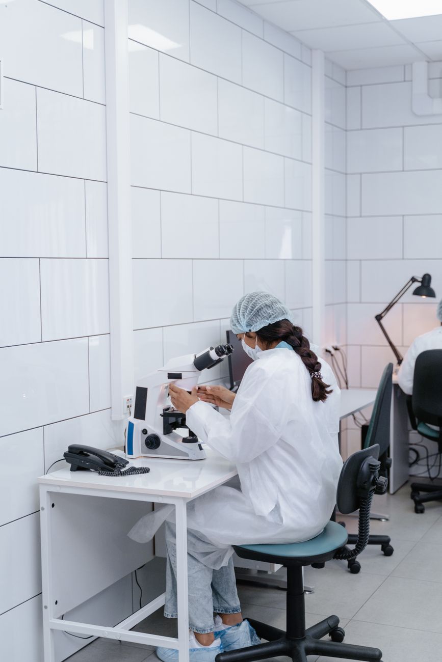 Embryology lab work under a microscope mirrors the technical confidence that patients are often asked to trust.