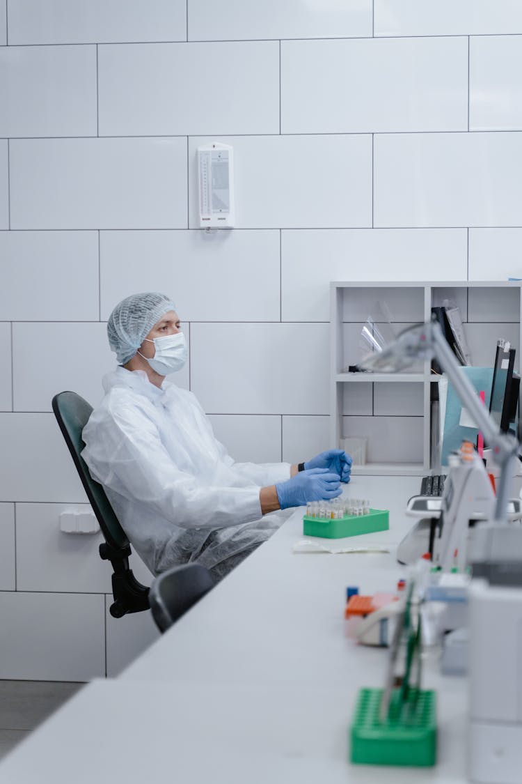 Medical Technologist Looking At A Computer Monitor 