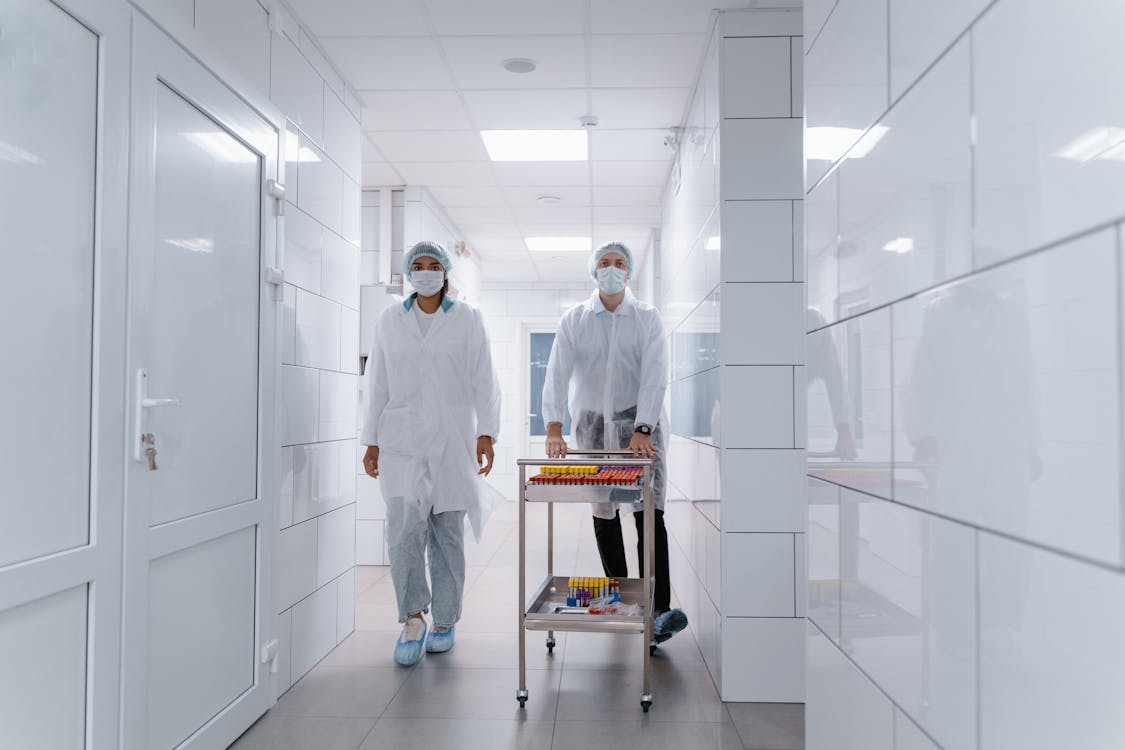 Medical Professionals walking on a Hallway 