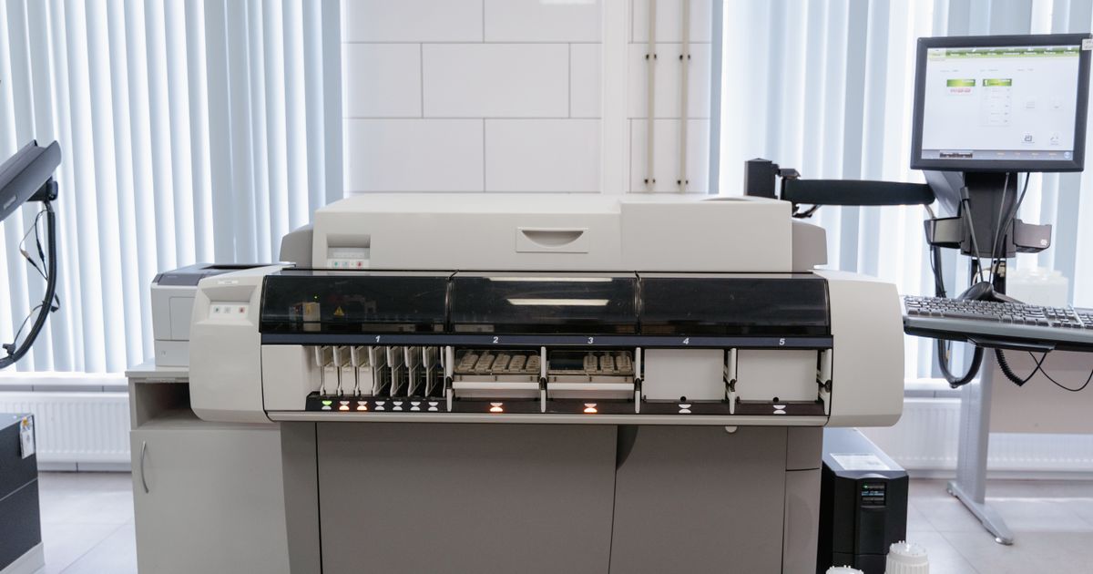 Office printer and computer workstation ready for use.
