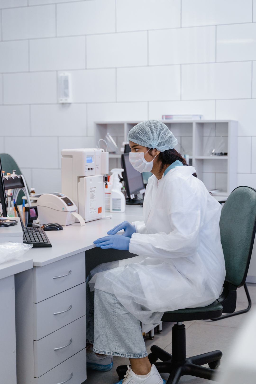 Food scientist at a lab bench reviewing stability samples