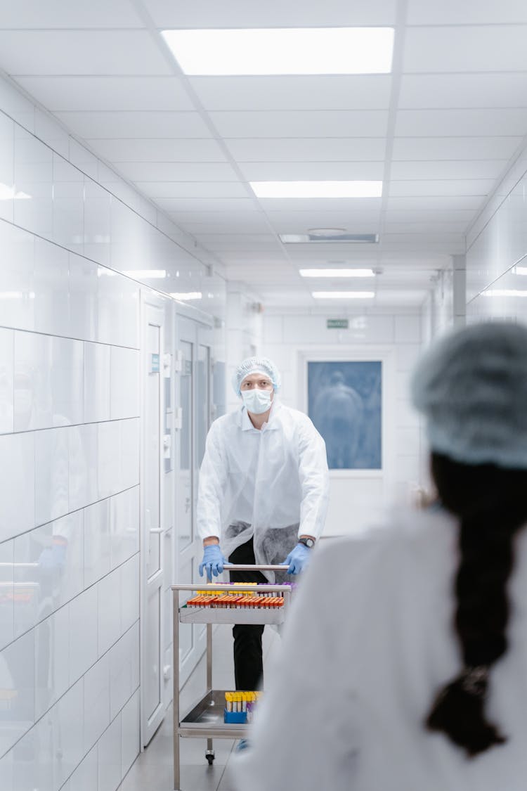 Man Pushing A Cart With With Samples