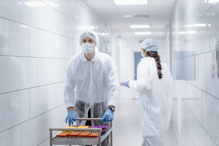 Man Pushing A Cart With Samples