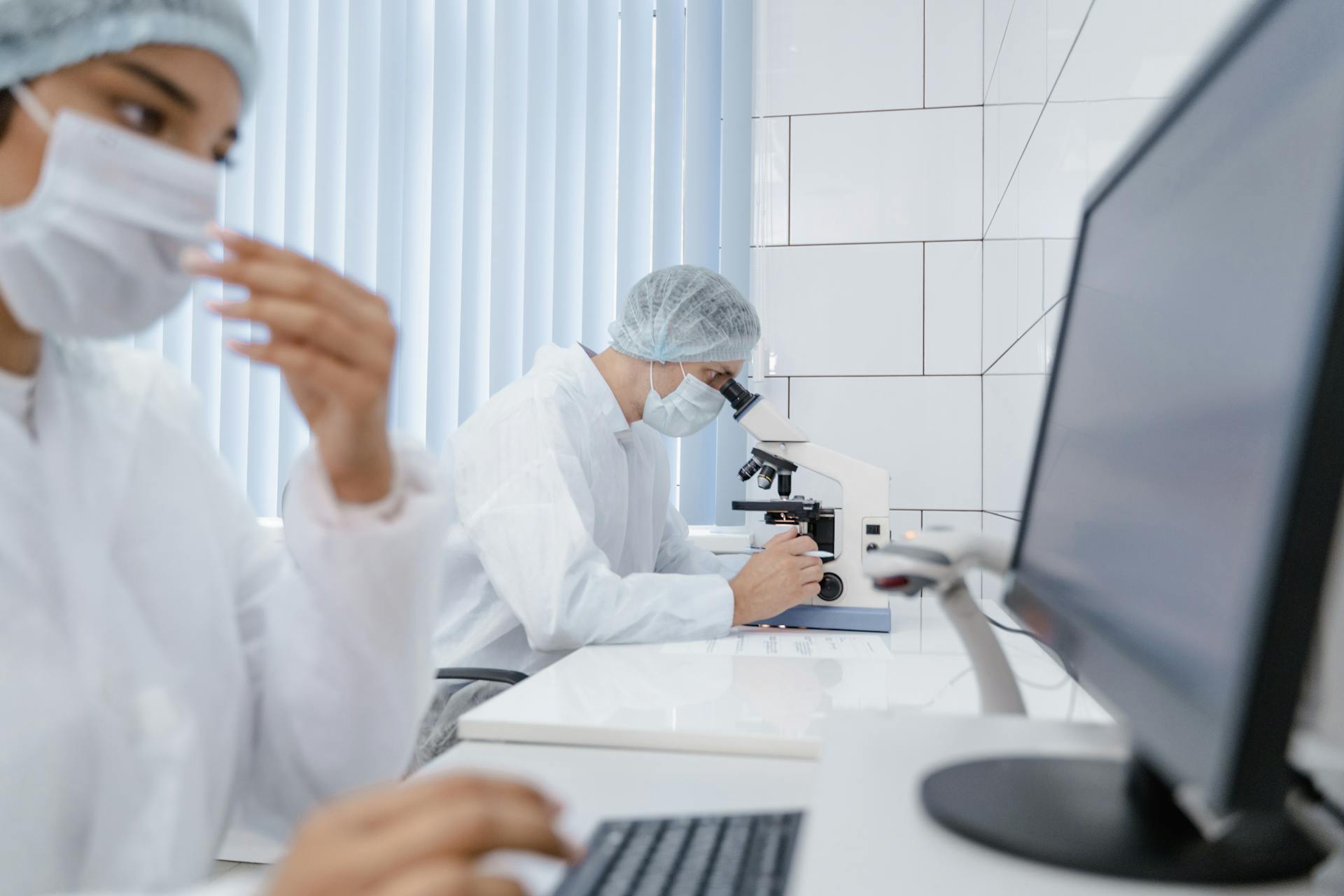 Man Looking at a Microscope