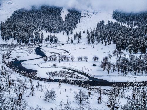 Free A breathtaking aerial view of a snowy landscape in Hajan, showcasing frozen trees and winding rivers. Stock Photo