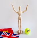 Brown Wooden Toy With Green Tennis Ball