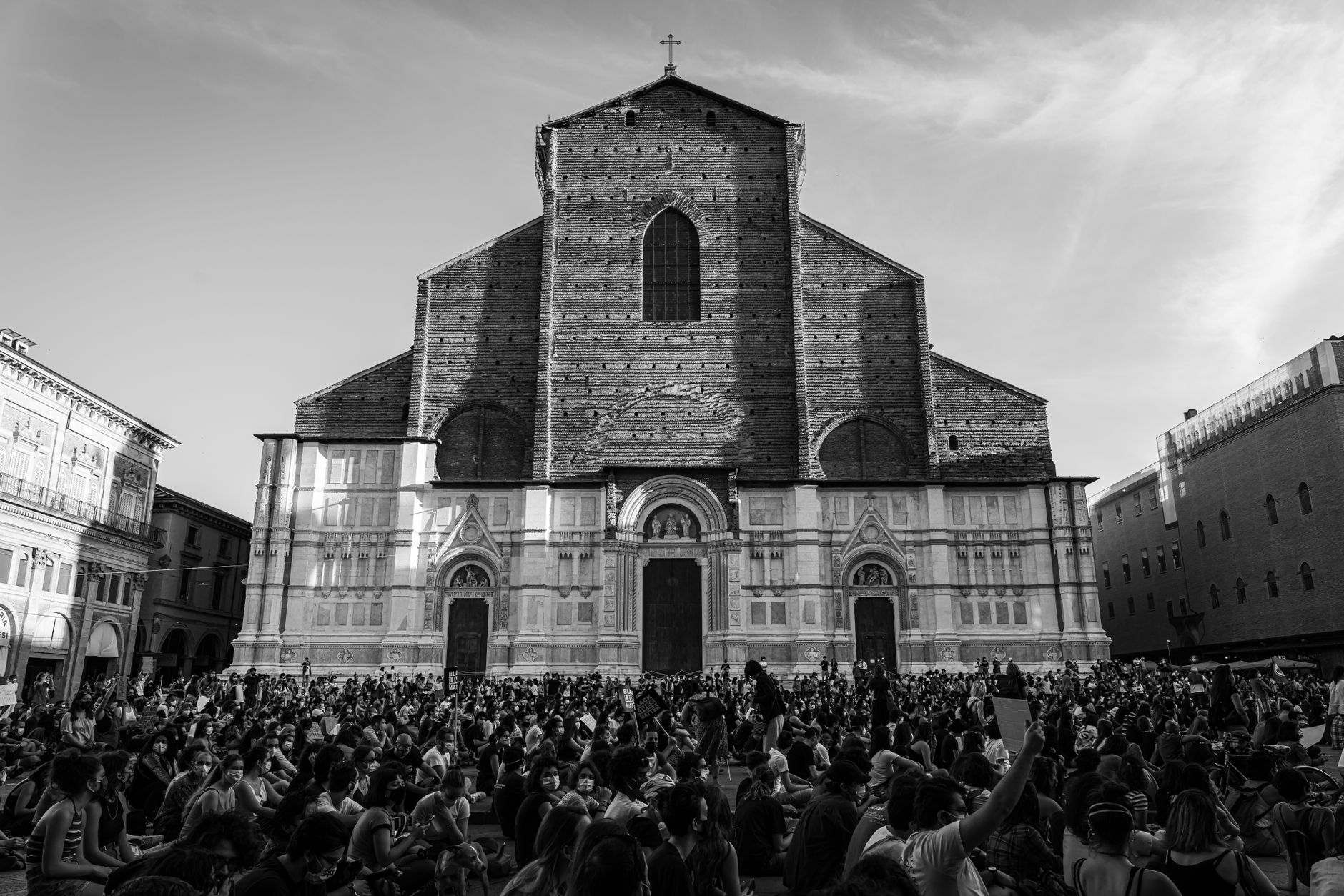 Black and white photo of Basilica di San Petronio with people gathered in front, Bologna