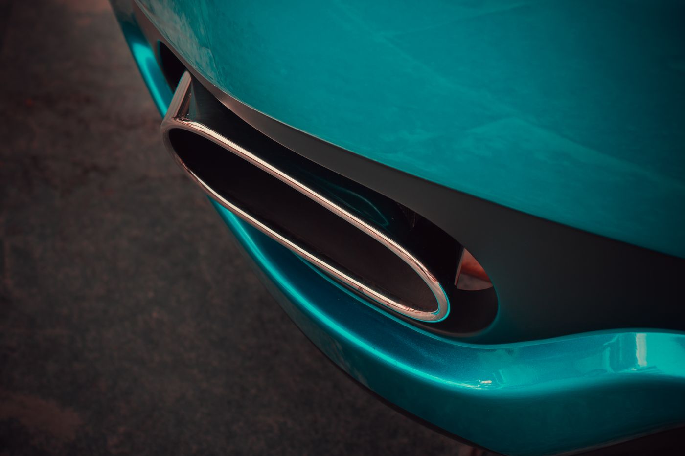 Close-up of a teal car body panel and vent — photo by Ammy K on Pexels