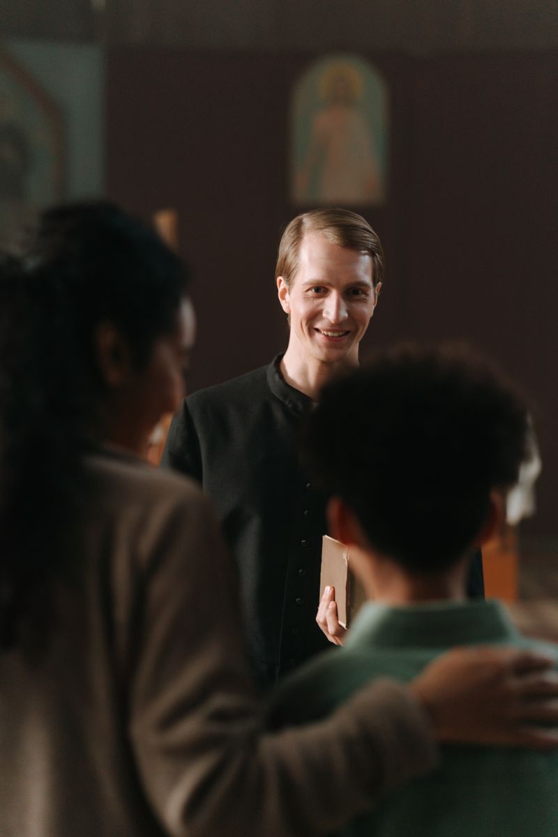 A pastor greeting a member of the congregation after the service