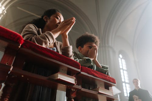 Free Mother and Son Praying Together Stock Photo