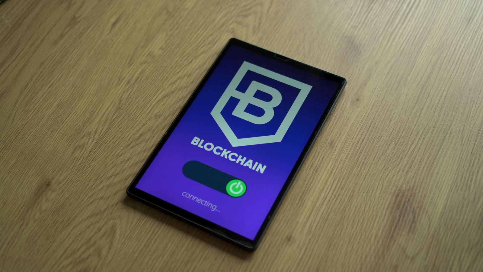 digital provenance compliance auditing: tablet showing blockchain interface for cryptographic provenance records.