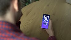 Person Holding Blue Screen Mobile Phone