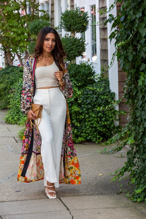 Stylish Woman Walking on Sidewalk