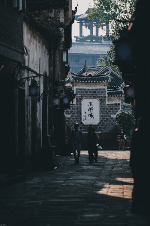 People walking in an Alley 