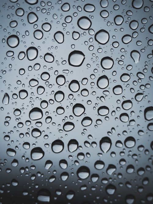 Free Close-up of raindrops on glass, highlighting texture and pattern. Stock Photo
