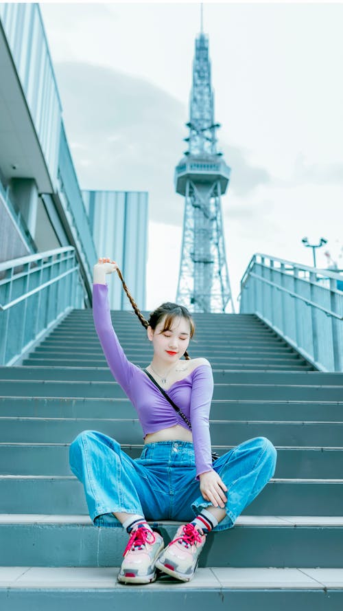 A Woman Sitting on the Stairs