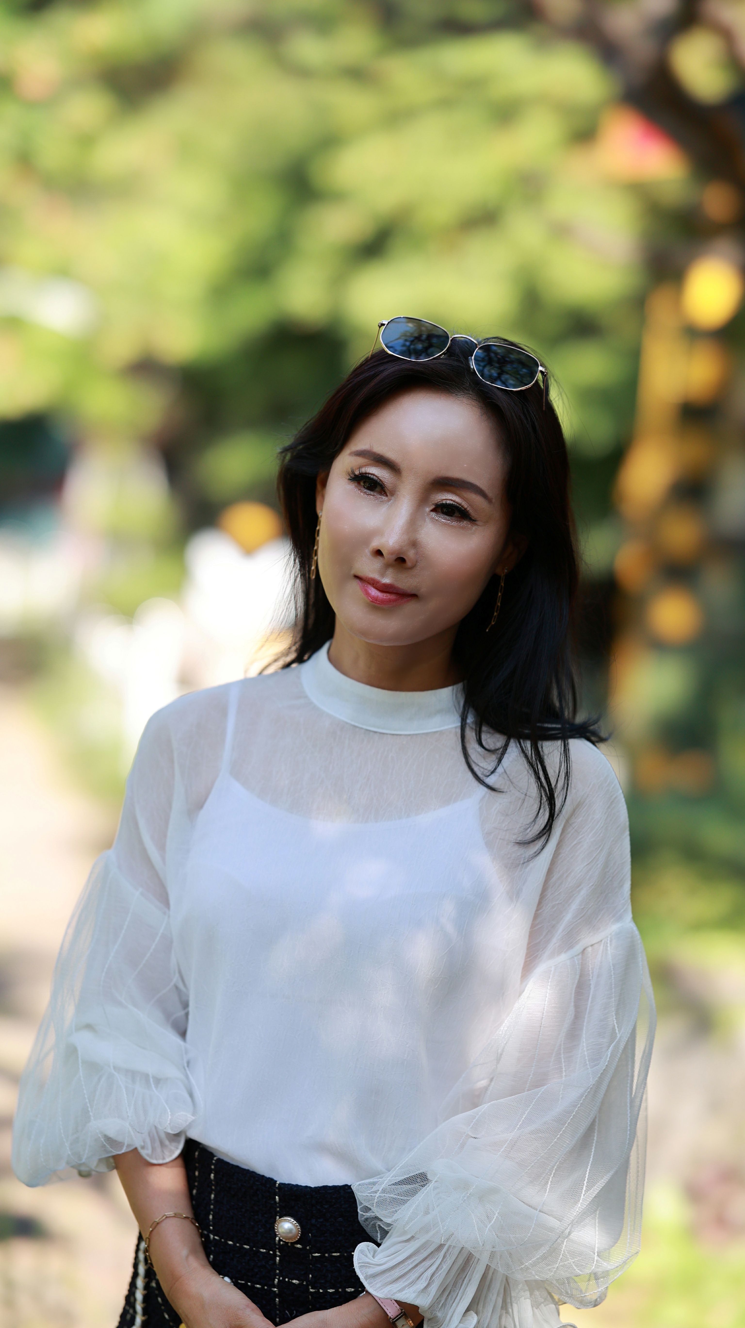 A Woman in White Long Sleeve Shirt · Free Stock Photo