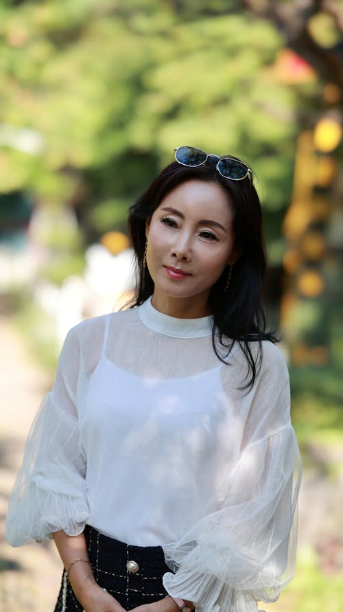 A Woman in White Long Sleeve Shirt