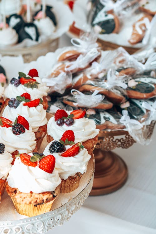 Free Cupcakes with Frosting and Berries Stock Photo