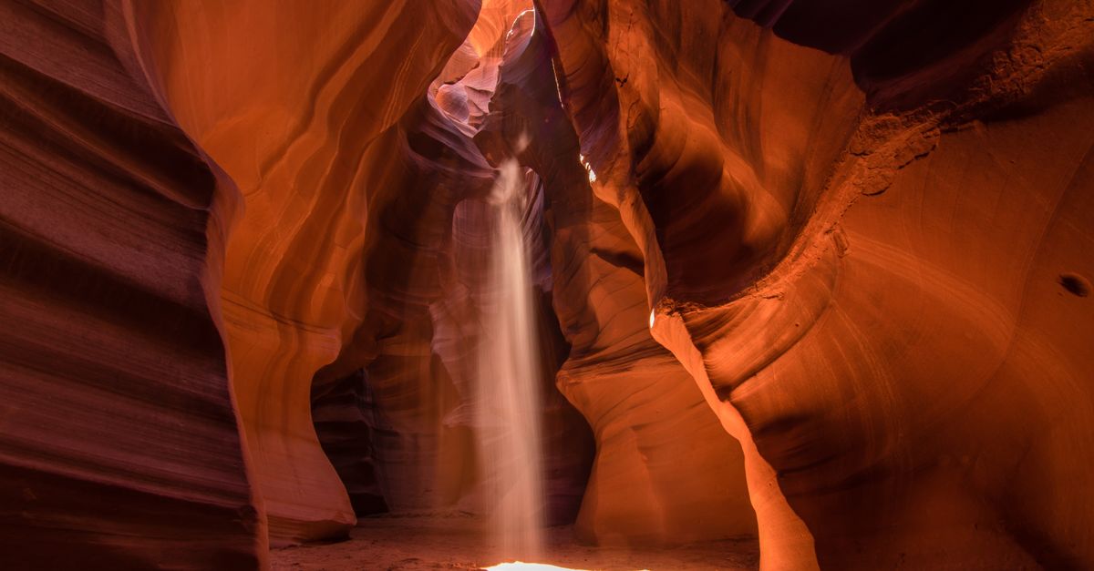 Stunning light beams cast through the red sandstone walls of Antelope Canyon in Arizona.