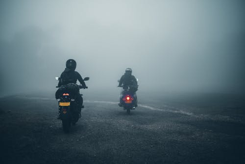 Riders Passing a Foggy Road