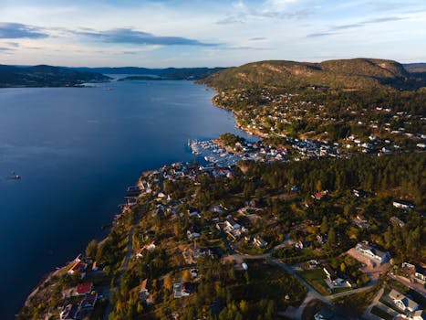 Breathtaking aerial view of Viken's coastline and peaceful residential area at dusk.