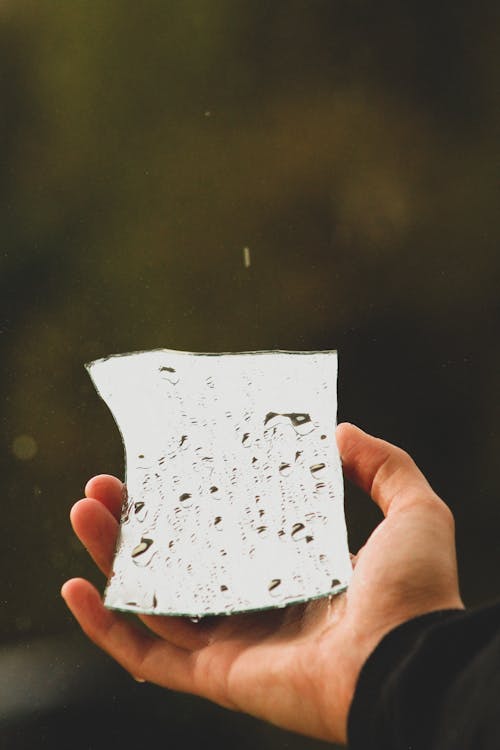 A Person Holding a Broken Mirror