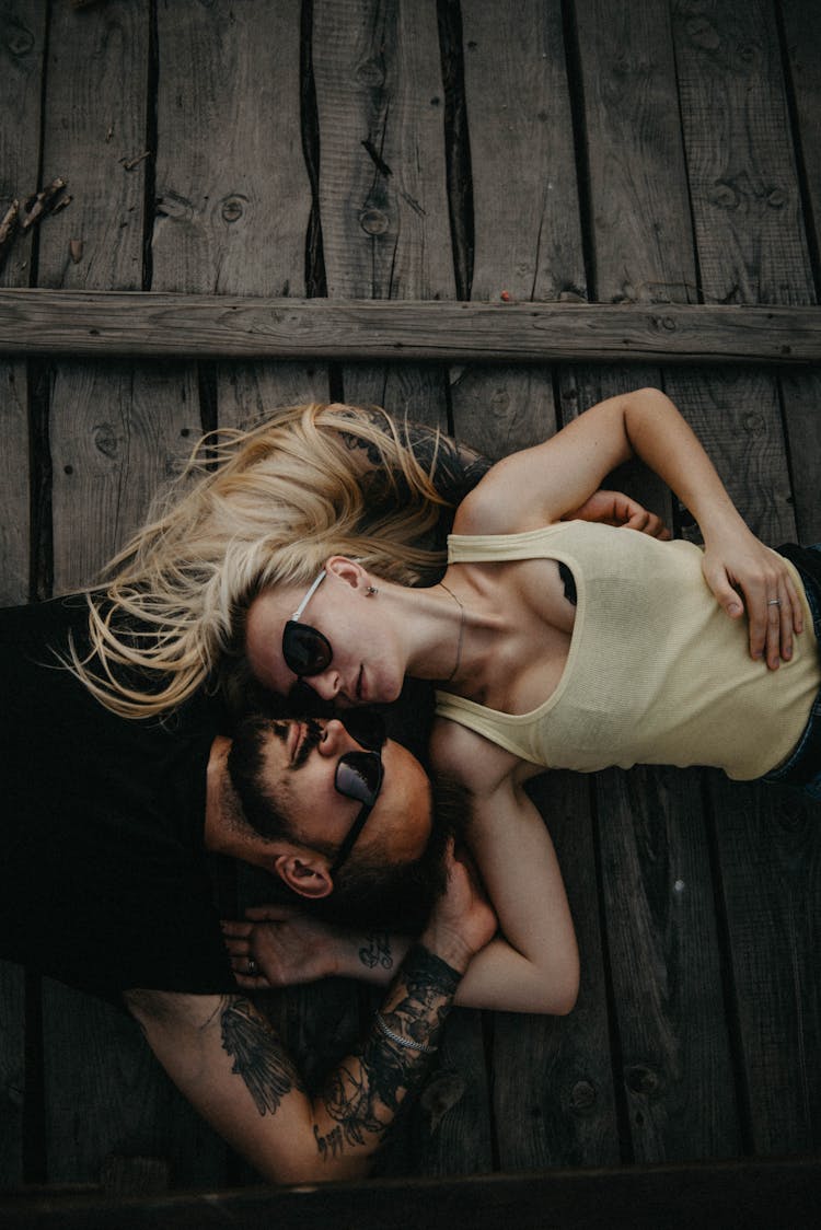 Couple Lying Together On The Floor 