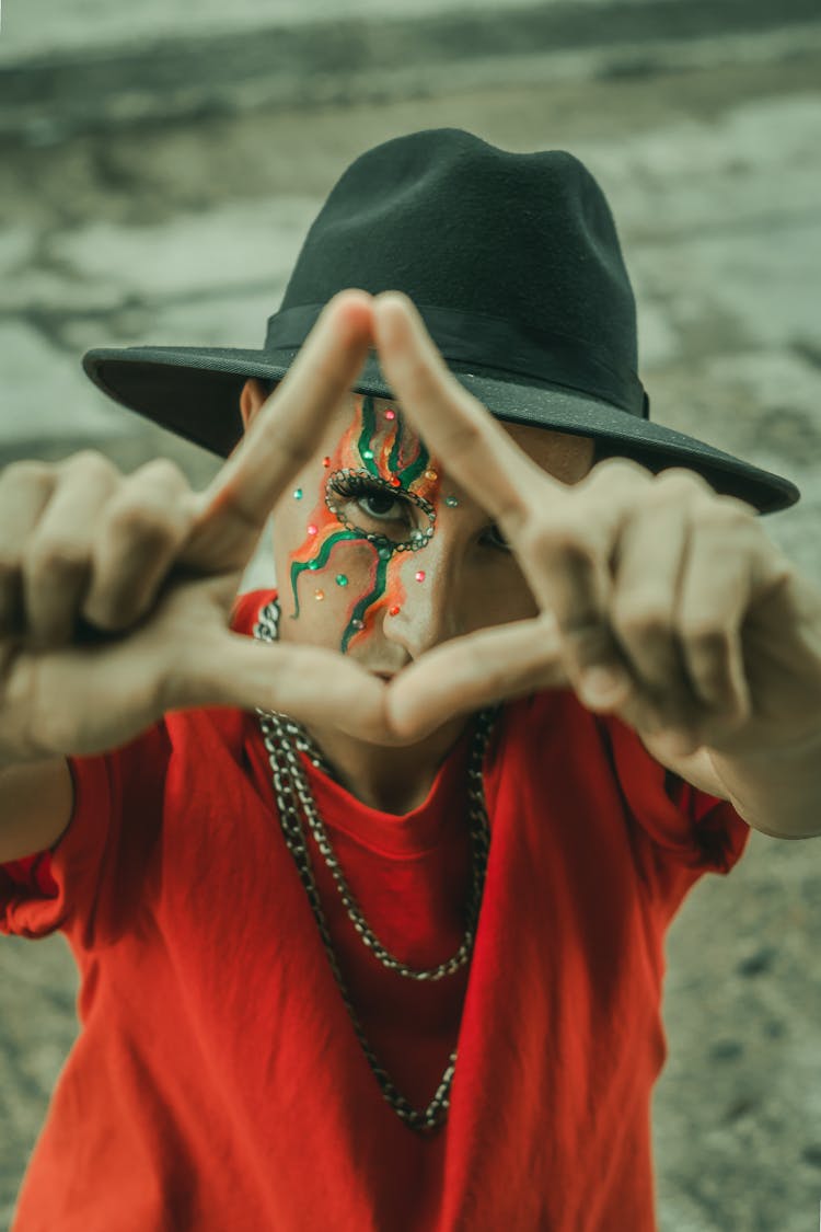 Person In Red Long Sleeve Shirt With Black Hat