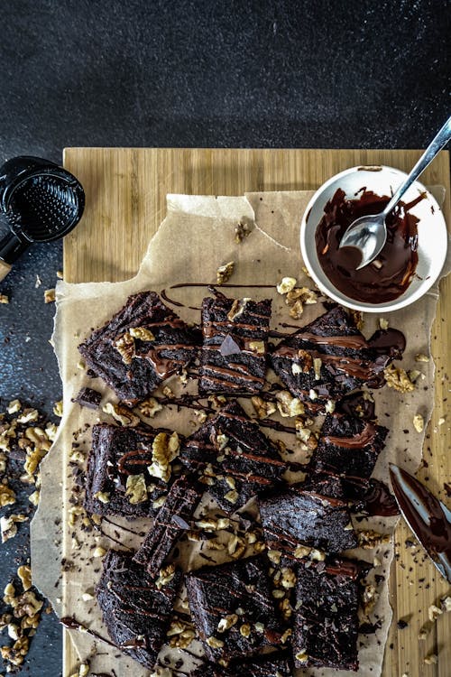 Free Brownies on Brown Wooden Chopping Board Stock Photo