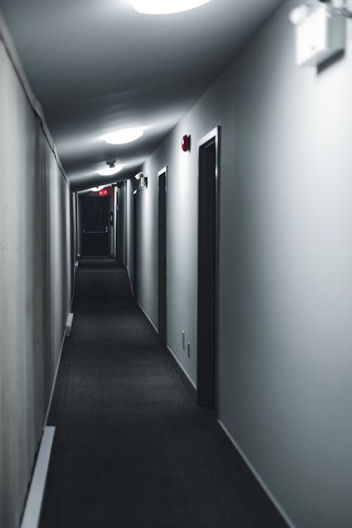 An Empty Hallway with White Wall