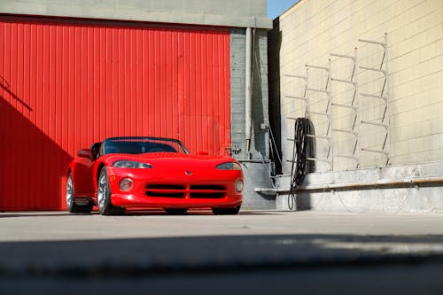 A Red Car Parked on the Street