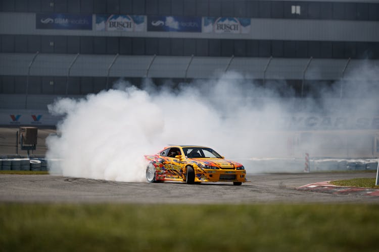 A Yellow Sports Car Drifting