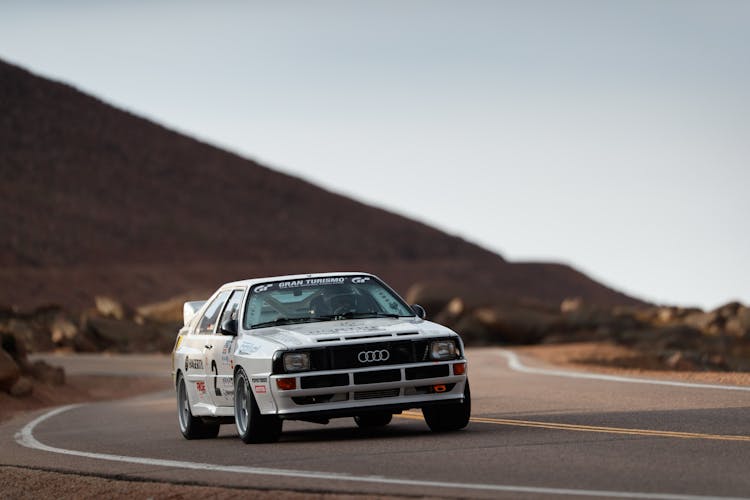 White Racing Car Moving On The Road