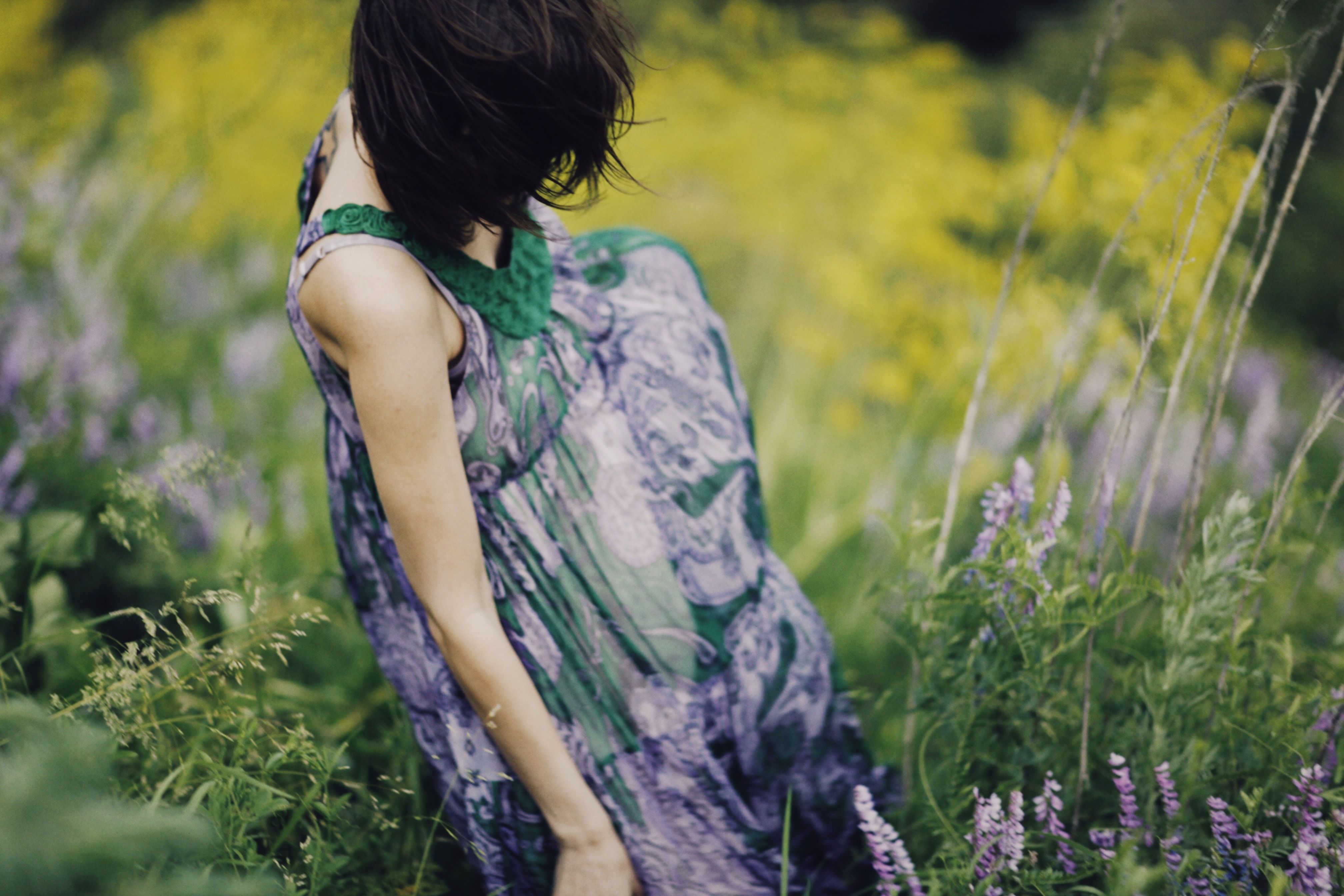 Woman in Green Dress Standing on Grass Field · Free Stock Photo