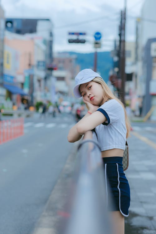 Beautiful Young Woman leaning on Handrail