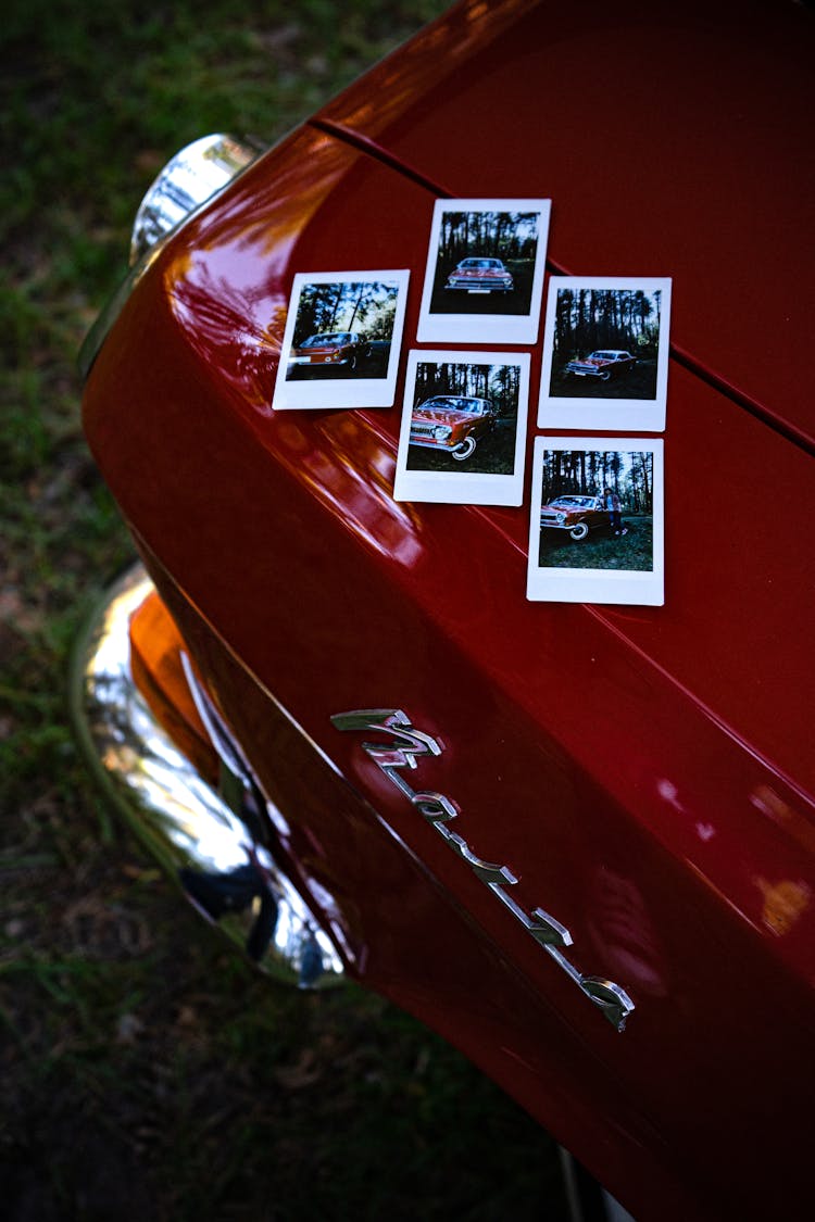 Photographs On The Hood Of A Car 