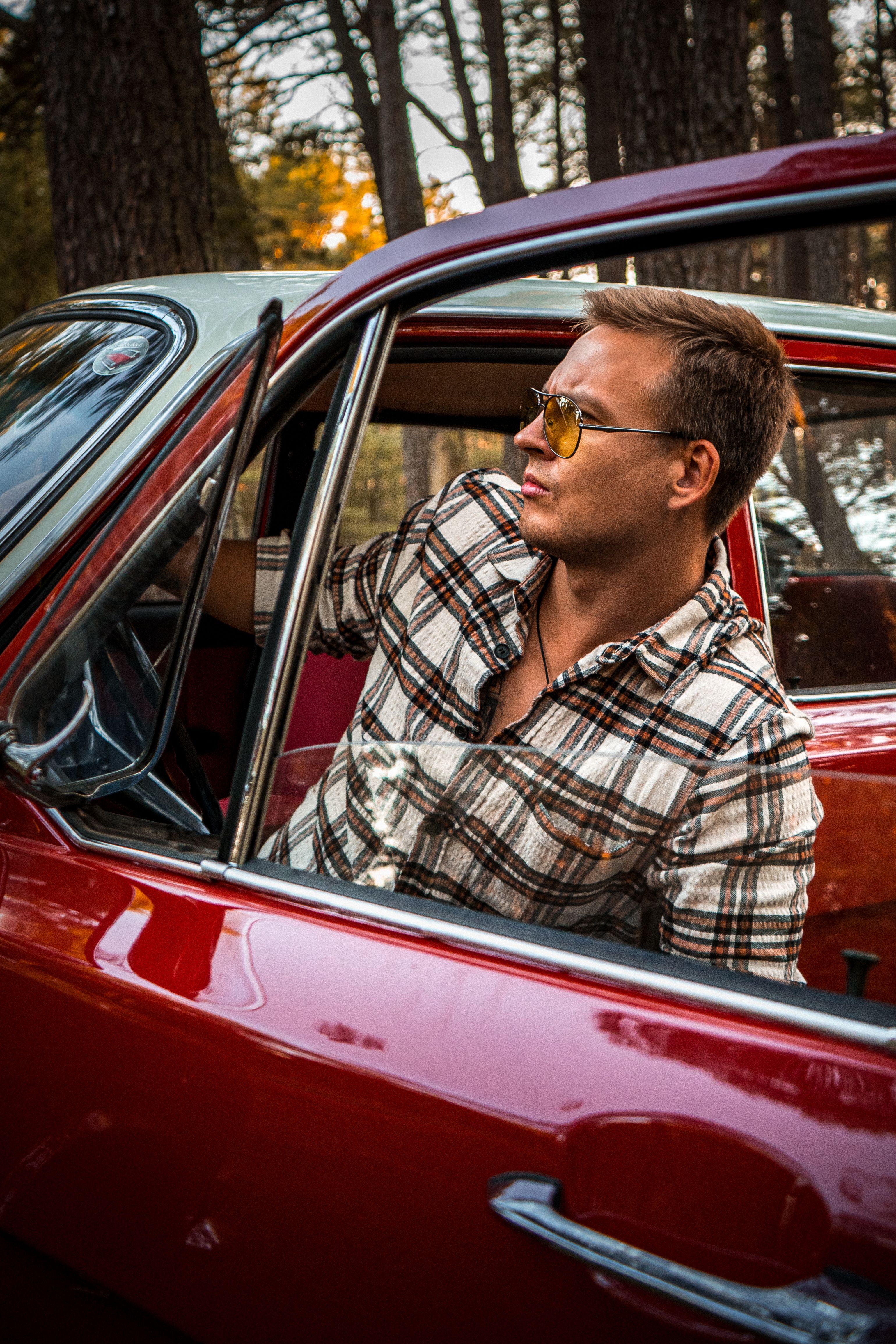 Man Inside a Red Vehicle · Free Stock Photo