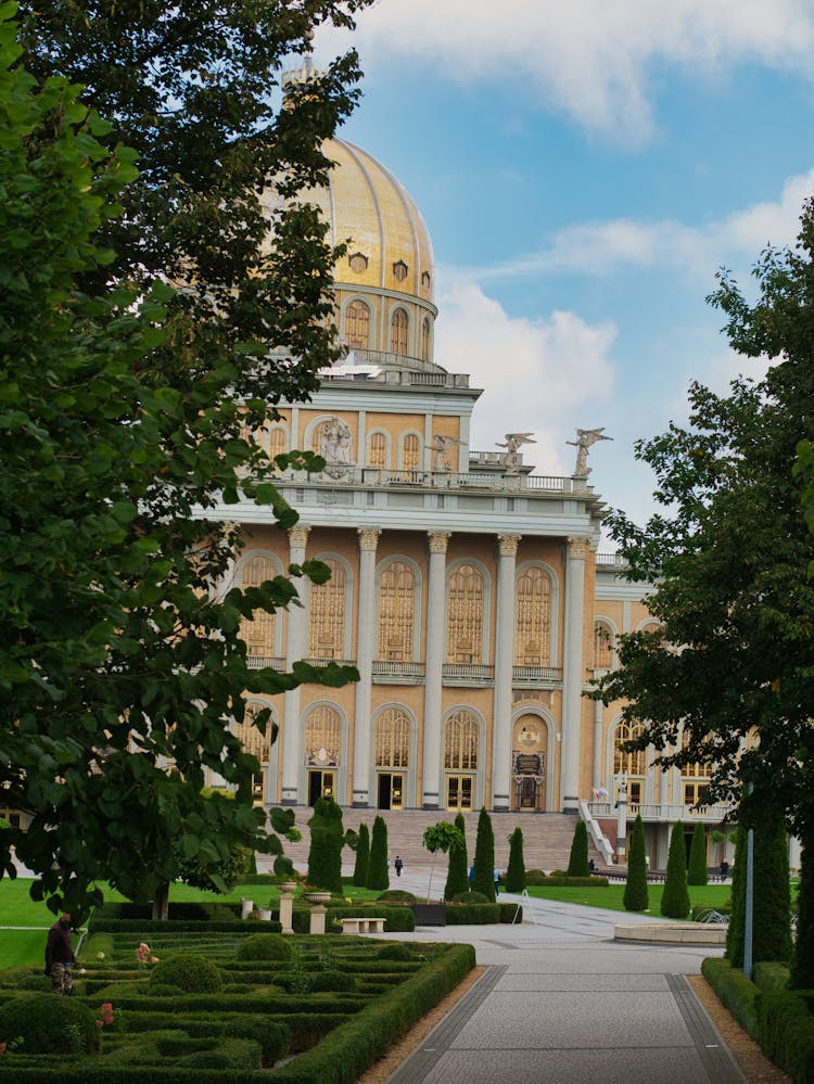 Garden And The Dome Of The Basilica Of Our Lady Of Lichen In Poland 